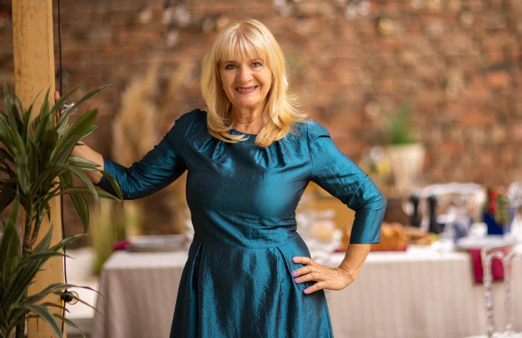 Portrait of mature woman before garden party in backyard