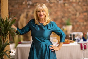 Portrait of mature woman before garden party in backyard