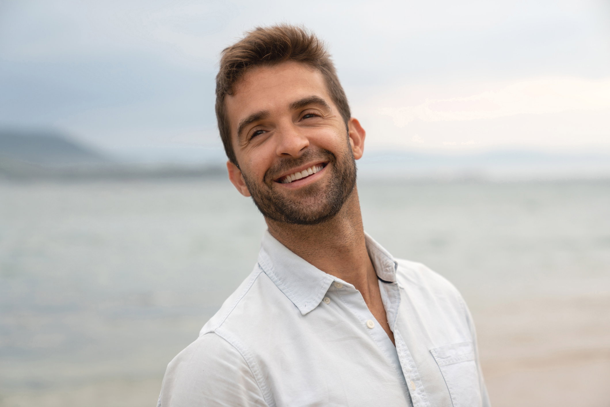 Portrait of a happy man at the beach