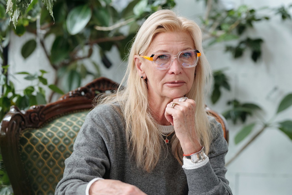 Portrait of Senior Caucasian Woman Using Tablet in Office