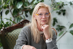 Portrait of Senior Caucasian Woman Using Tablet in Office