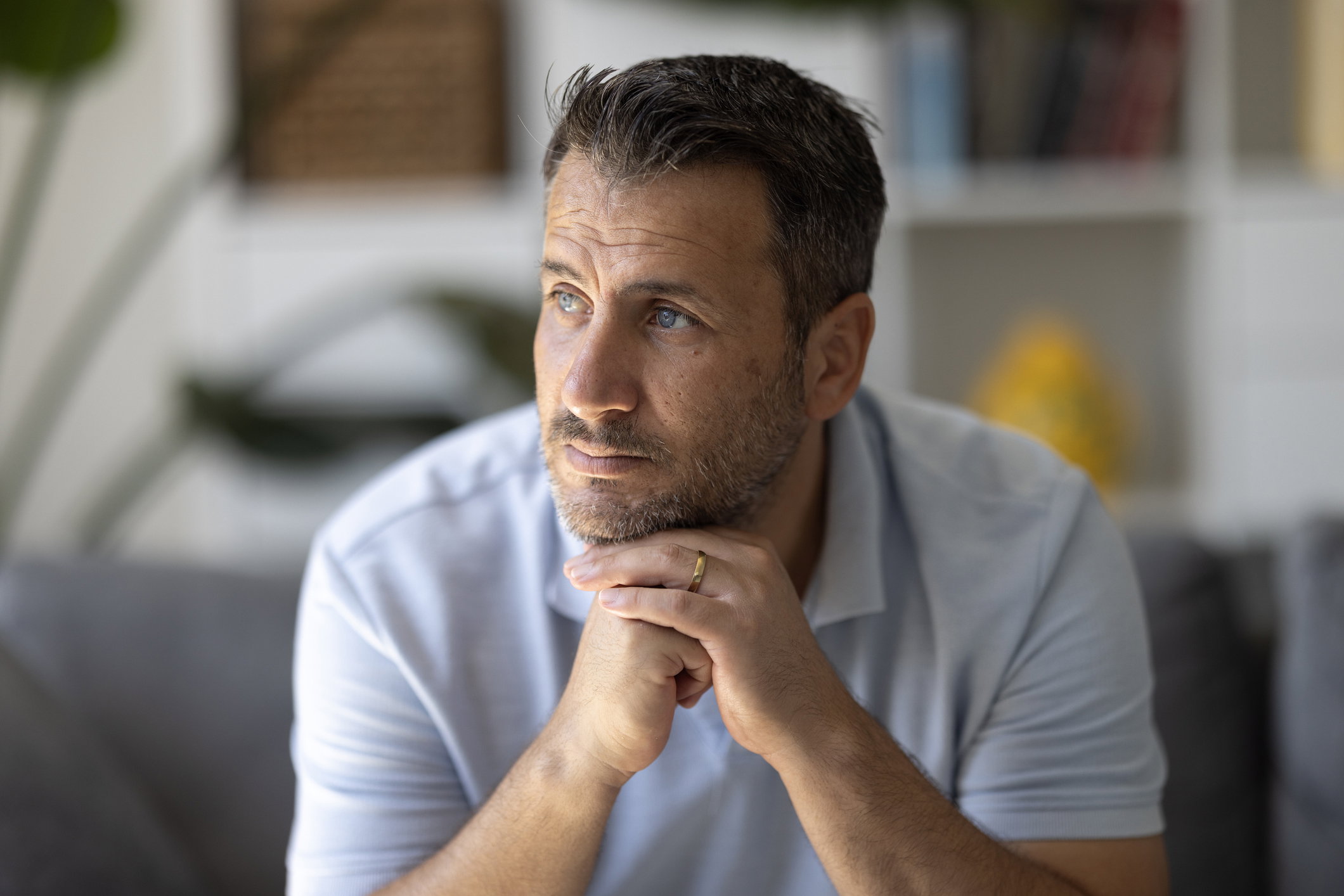 Pensive lost in thoughts suffering from depression
