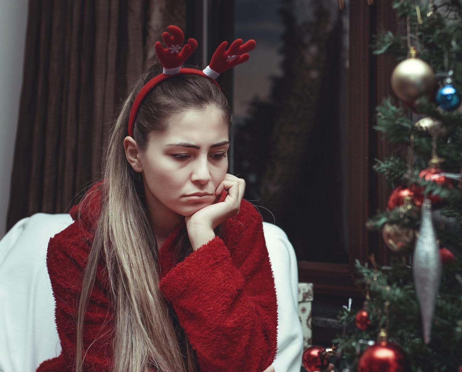 sad young woman alone at christmas
