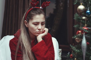 sad young woman alone at christmas