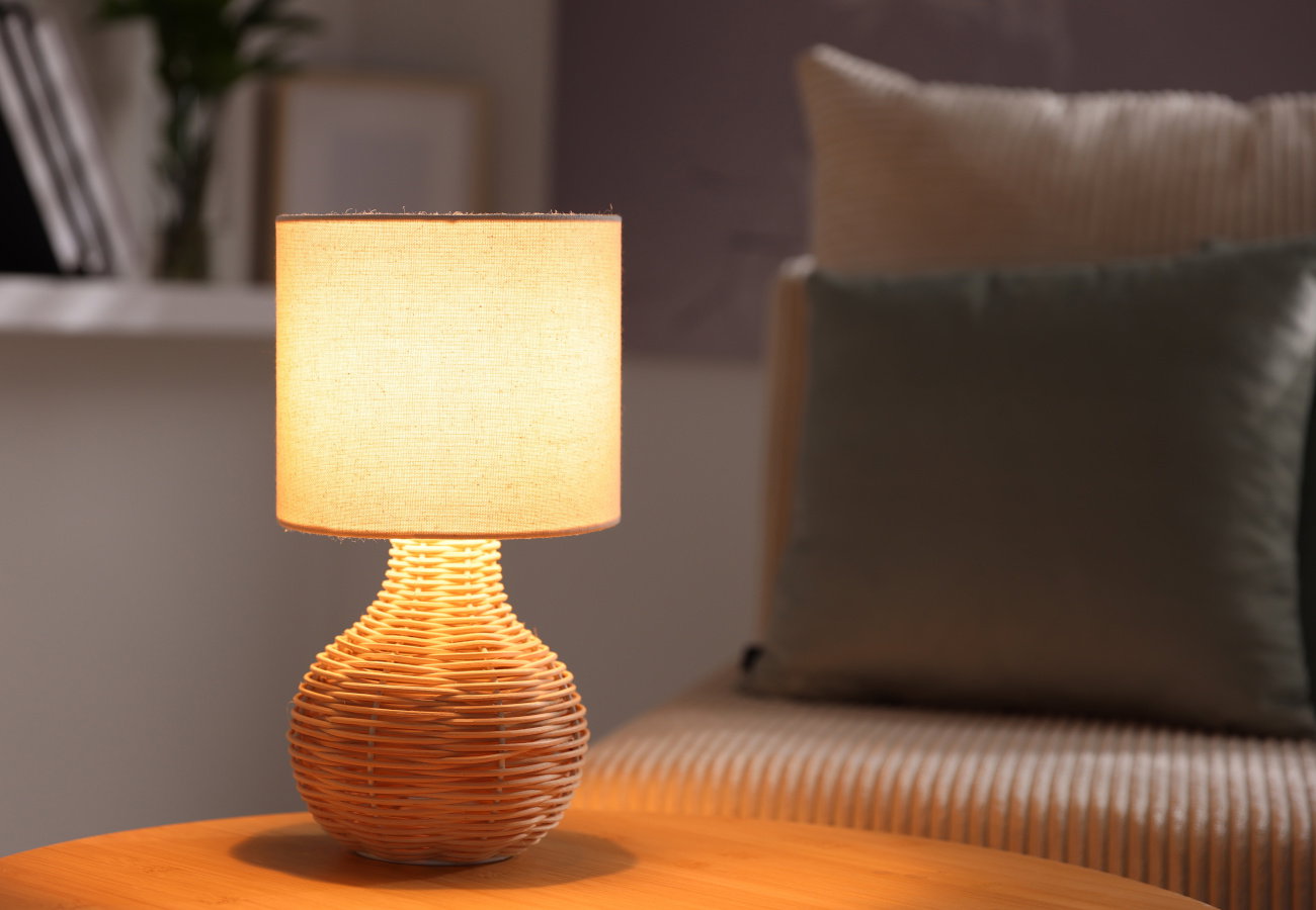 Stylish night lamp on wooden table indoors
