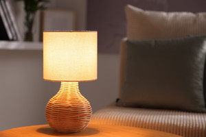 Stylish night lamp on wooden table indoors