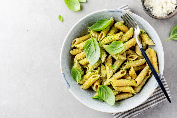 Tasty appetizing pasta with pesto sauce