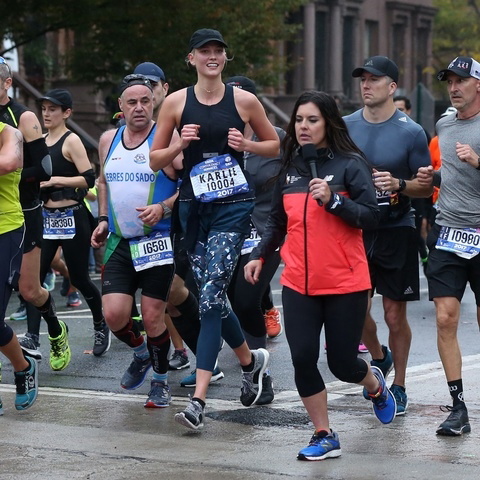 Model Karlie Kloss runs past mile marker 22 in the TCS New York City Marathon in New York City, New York