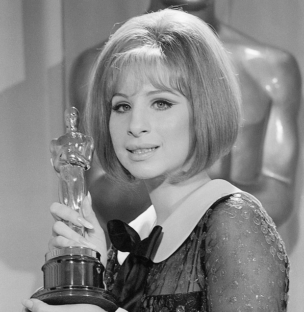 Barbra Streisand Holding Academy Award
