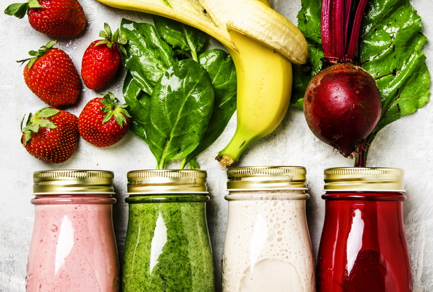 Multicolored smoothies and juices from vegetables, fruits and berries, food background, top view