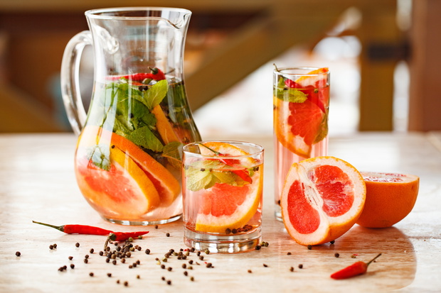 grapefruit mint lemonade on table with pepper and chili