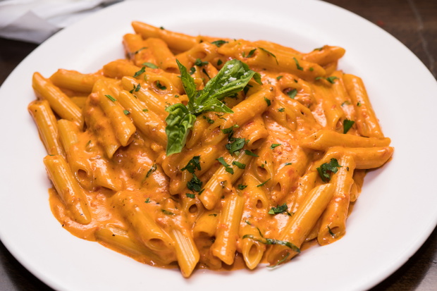 Table top shot of delicious beautiful prepared bowl of penne ala