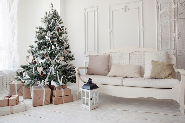 Christmas tree with presents underneath in living room