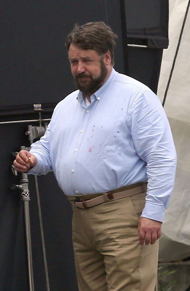 EXCLUSIVE: **EMBARGOED UNTIL 1PM EDT JULY 25, 2019** A bulked-up Russell Crowe looks almost unrecognizable on the set of his new movie.