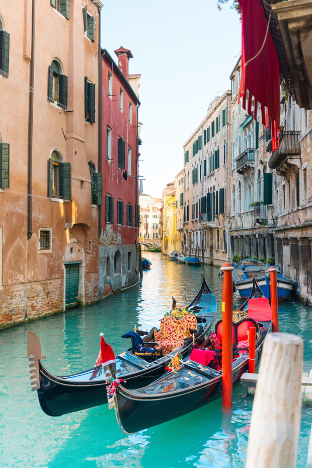 VENICE, ITALY- December 21, 2017 : Tourists on water street with Gondola in Venice,ITALY