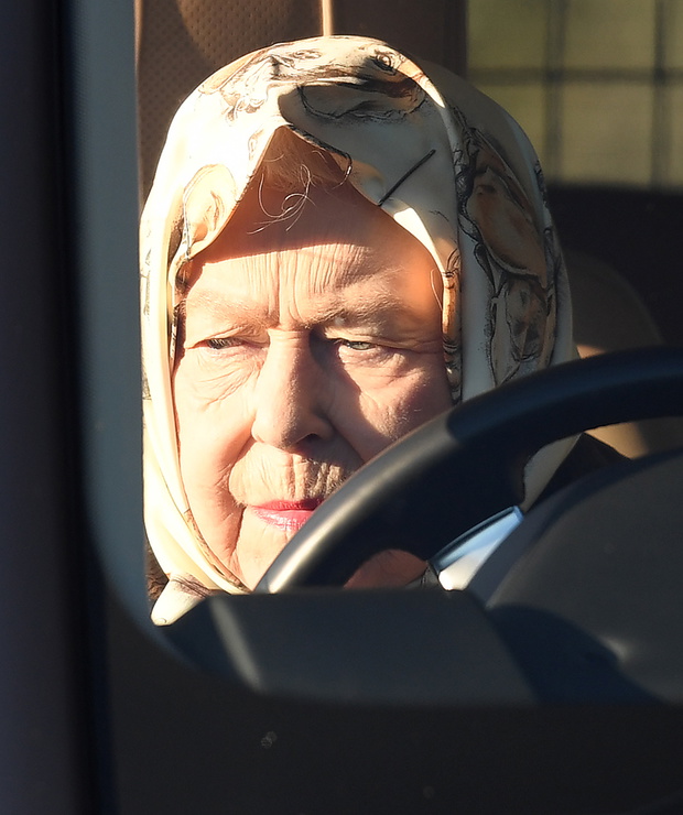 The Queen drives through Sandringham
