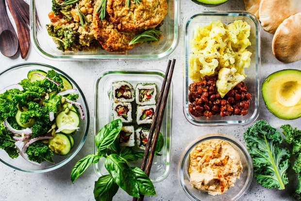 Healthy vegan food in glass containers. Flat lay of stew with ch