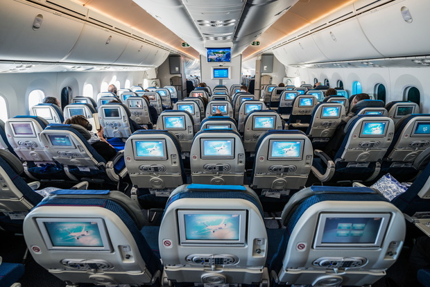 WARSAW, POLAND - FEBRUARY 25, 2015. Passengers sits in Boeing 787 Dreamliner of LOT Polish Airlines before flying start in Warsaw