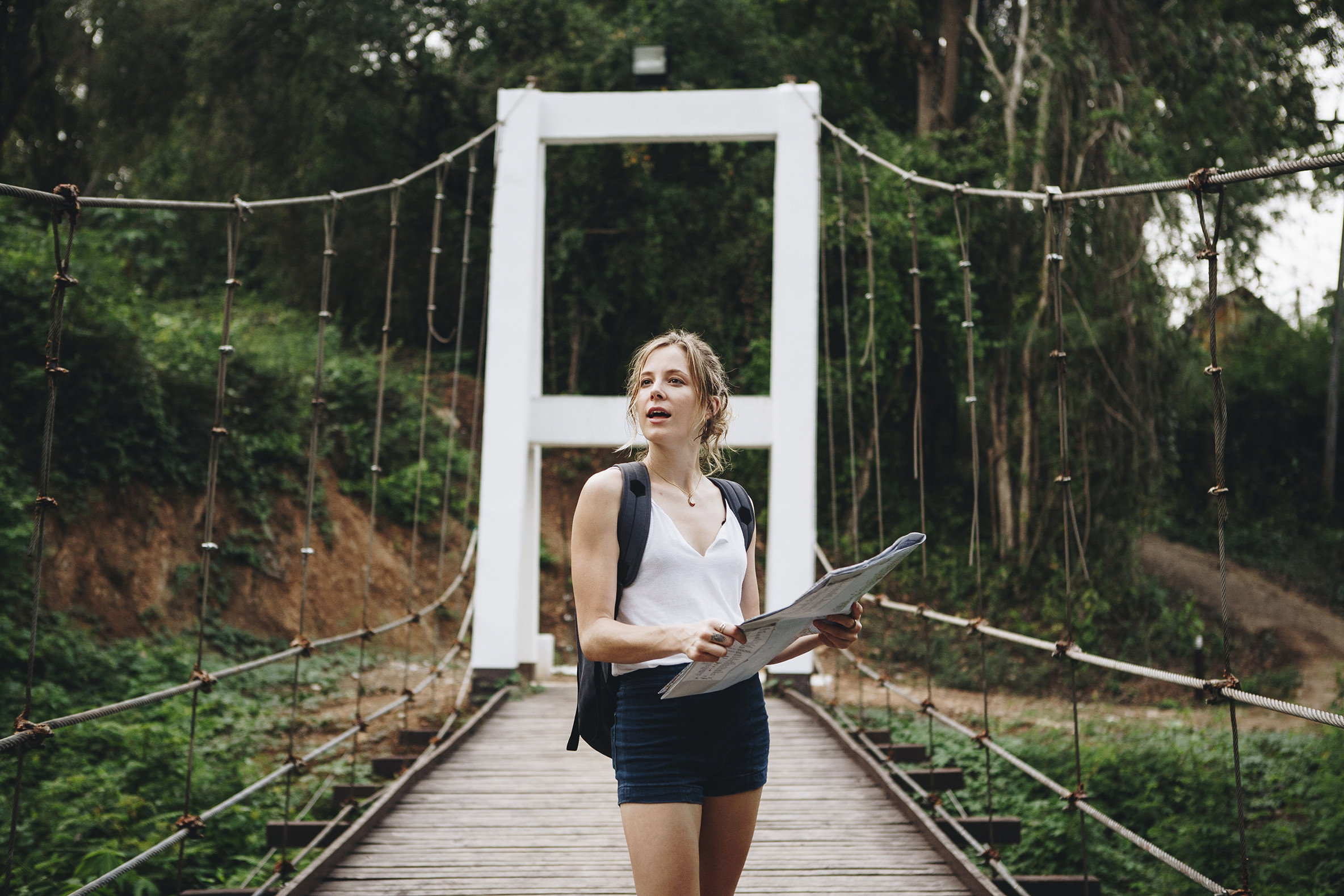 caucasian-woman-looking-at-a-map-travel-and-explor-PPN4K63 (1)