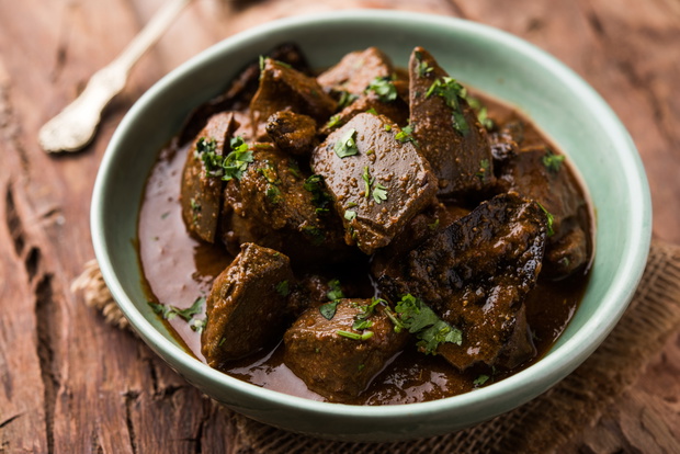 Mutton Liver fry or Kaleji masala, popular Non vegetarian recipe from India and Pakistan. served dry or with curry in a bowl, karahi or plate