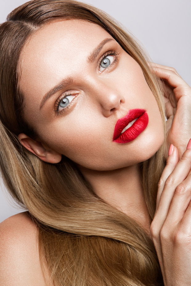 Beautiful young model with red lips