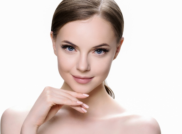 Beautiful brunette woman with beauty lashes and pink lipstick healthy skin isolated on white