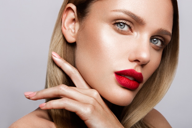 Beautiful young model with red lips