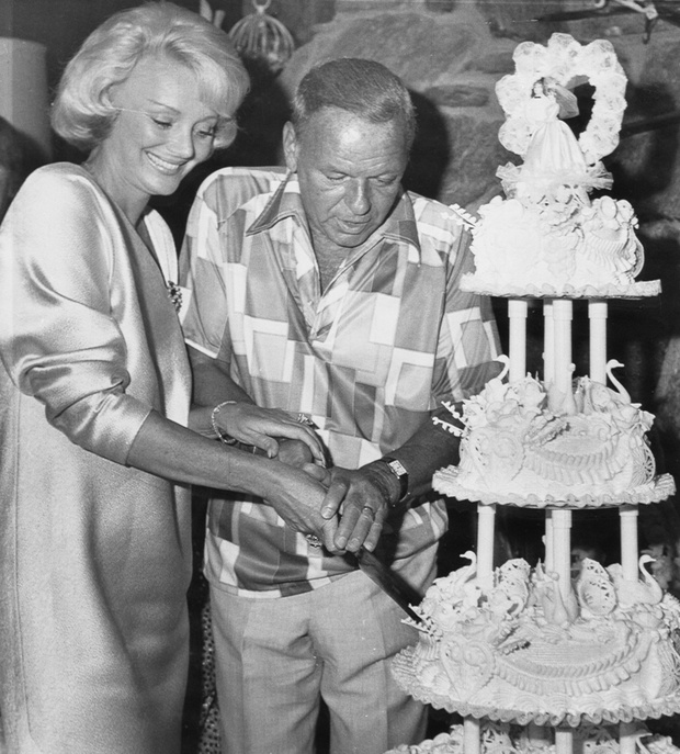 Frank Sinatra Cutting Wedding Cake with His Wife