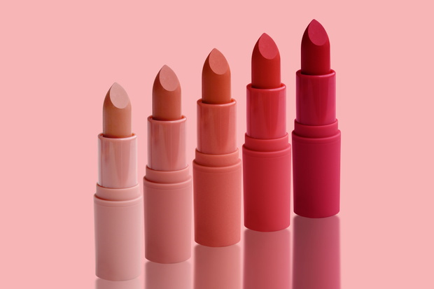 set of matte lipstick on a delicate pink background, red, raspbe