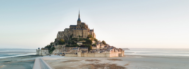 Le Mont Saint Michel tidal island in beautiful twilight at dusk,