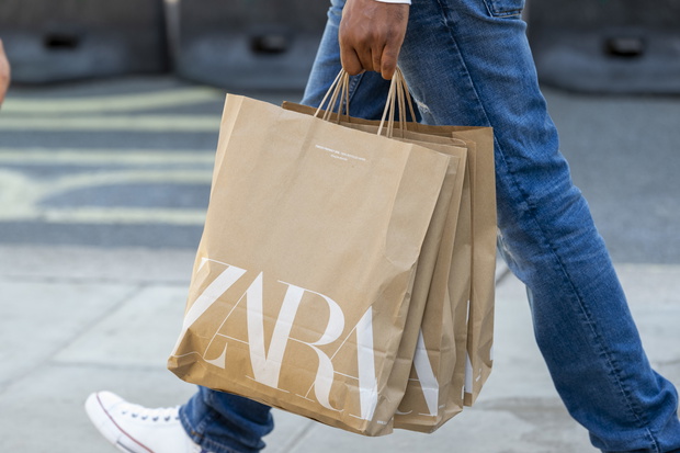 A shopper carries Zara shopping bags on Londons Oxford