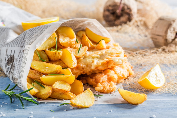Closeup of delicious fish cod with chips with lemon