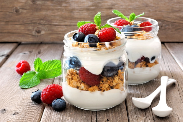 Blueberry and raspberry parfaits in mason jars, still life again