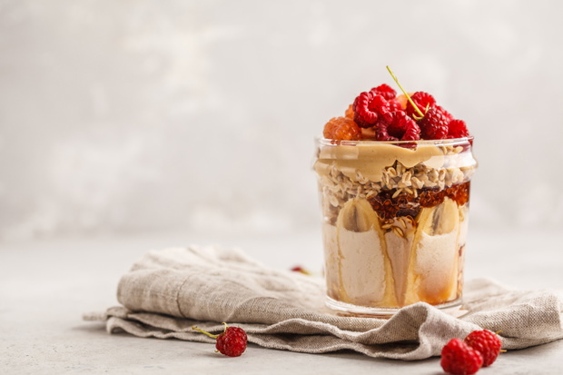 Overnight oatmeal with berries, peanut butter, banana and berrie