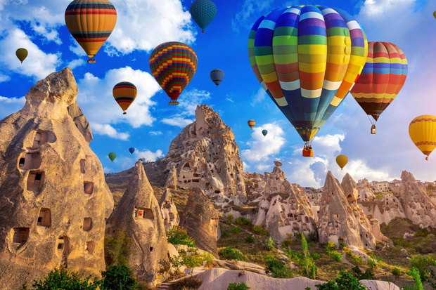 Colorful hot air balloon flying over Cappadocia, Turkey.