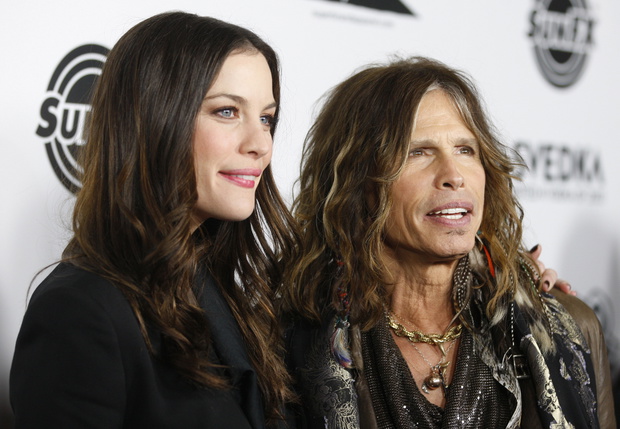 Actress Liv Tyler arrives for the premiere of her new film "Super" with her father, musician Steven Tyler, in Hollywood