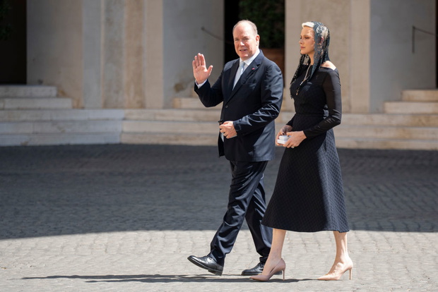 Prince Albert II and Princess Charlene walk through the San