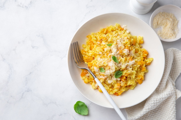 Pumpkin risotto in white bowl