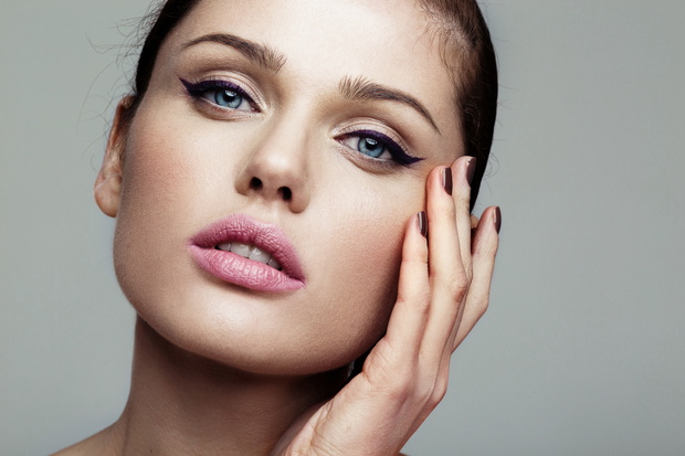 close-up beauty shot of young pretty model with bright make-up.