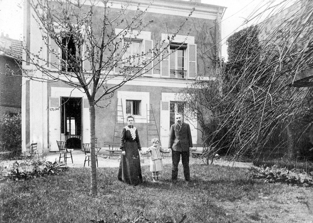 Pierre and Marie Curie with their daughter Eve, in