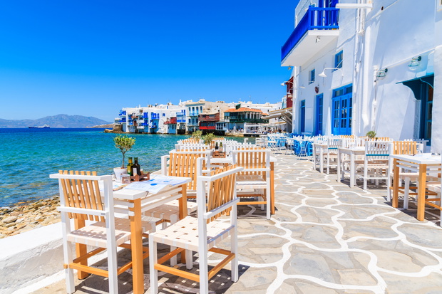 Chairs with tables in typical Greek tavern in Little Venice part