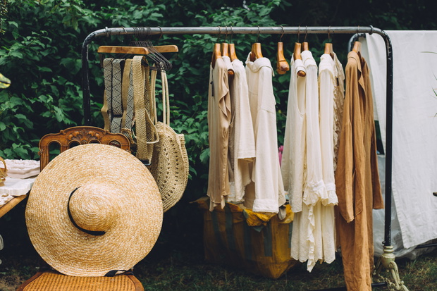Clothes hanger with dresses in the woods.