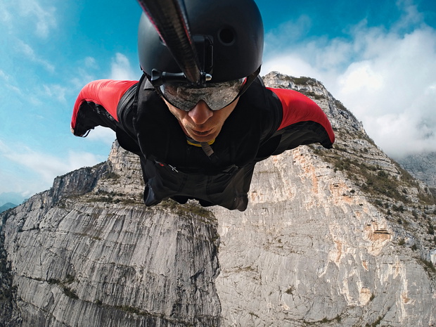 base jumper in flight from the cliff