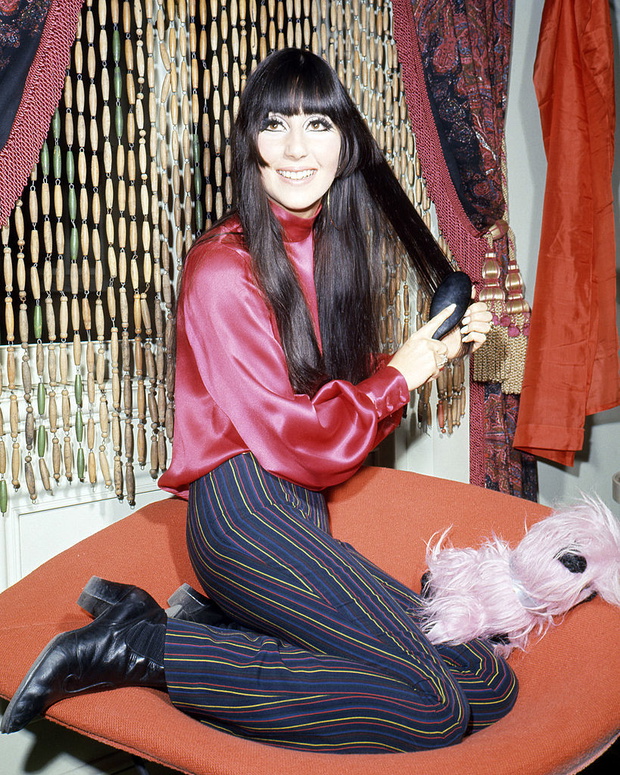 Cher Brushes Hair