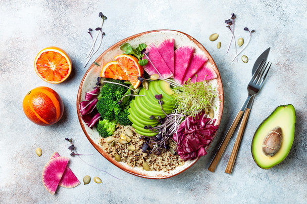 Vegan, detox Buddha bowl with quinoa, micro greens, avocado, blo