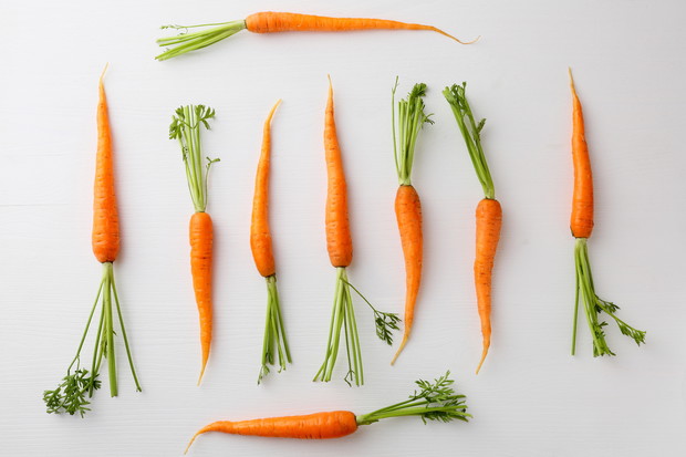 carrots top view on white background