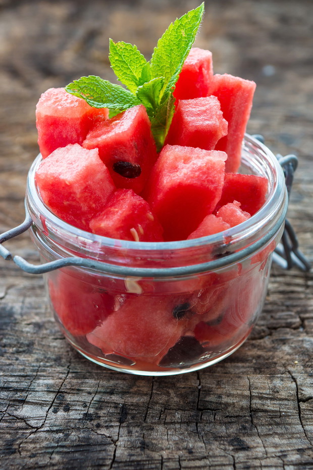 Fresh sliced watermelon on wooden background