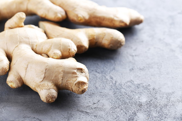 Ginger root on grey wooden table