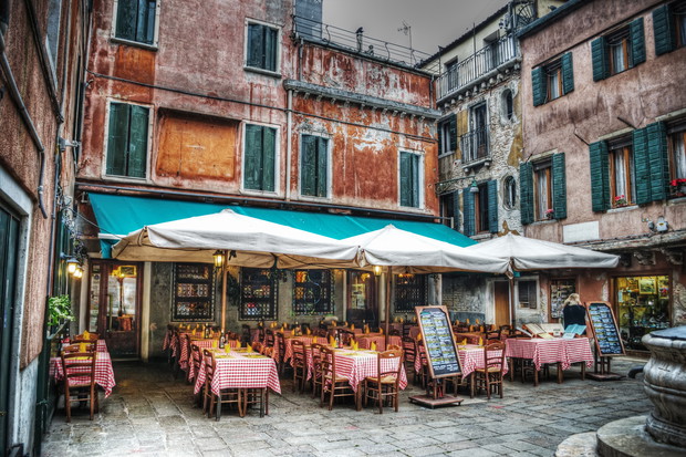 restaurant tables and chiairs in a small square
