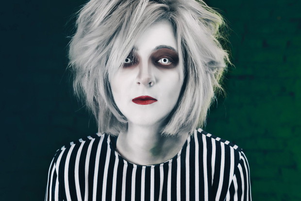 creepy portrait of halloween girl. Creepy eye lenses and make-up